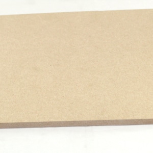 May include: A plain, light brown, rectangular piece of wood.
