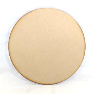 May include: A round, unfinished wooden disc, perfect for crafting projects. The disc is light brown and has a smooth surface.