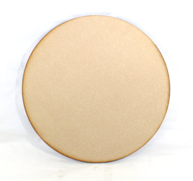 May include: A round, unfinished wooden disc, perfect for crafting projects. The disc is light brown and has a smooth surface.