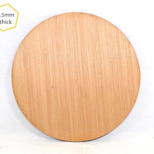 May include: A round, wooden disc with a natural wood grain finish. The disc is 5.5mm thick.