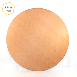 May include: A round, light brown wooden disc with a smooth, brushed finish. The disc is 5.5mm thick.