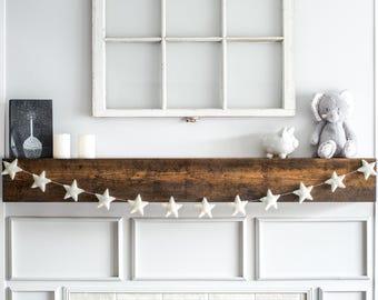 Guirnalda de estrellas de fieltro de lana blanca: Decoración navideña para la habitación del bebé.