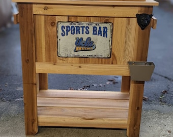All Weather UCLA Rustic Ice Chest Cooler Stand with Brass Drain, Bottle Opener, and Bottle Cap Catcher, College Football