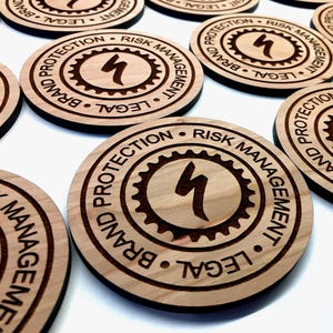 Personalized wood coasters with business logo engraved for bulk orders.