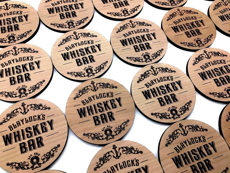 Personalized wooden coasters with laser-etched company logos, ideal for client appreciation gifts, holiday business giveaways, or branded merchandise. Eco-friendly and made in the USA.