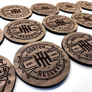 Custom engraved wood coasters with personalized business logo. Perfect for bulk gifts.