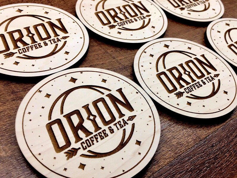 Set of personalized wooden coasters for weddings, businesses, or home décor. Laser-engraved with logos, names, or special dates for a meaningful and practical gift.