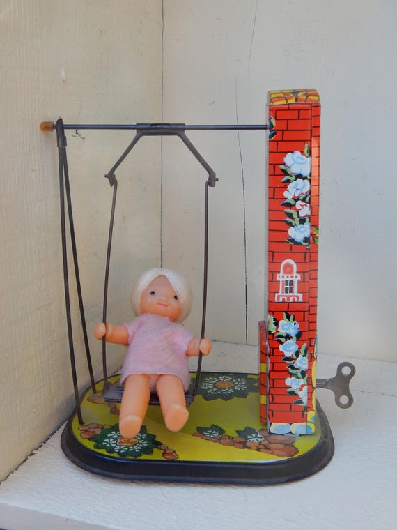 Vintage Wind Up Tin Lithograph Toy Girl On Swing With Key Retro Wind Up Toy With Moving Swing Blonde Doll And Primary Colors On Tin