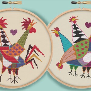 May include: Two colorful embroidered rooster designs in wooden embroidery hoops. The roosters are made of geometric shapes and have a whimsical, modern style.