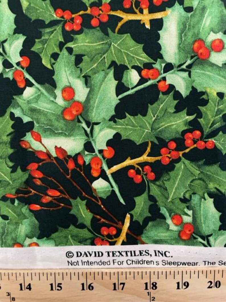May include: Fabric featuring a pattern of green holly leaves and bright red berries on a black background. The white selvage edge includes the text DAVID TEXTILES, INC. and Not Intended For Children's Sleepwear, positioned above a ruler showing inches.