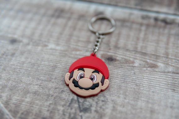 Aurabeam Portachiavi Ufficiale Super Mario: Fungo Rosso In Gomma Robusta, Accessorio Gaming Per Chiavi E Zaino