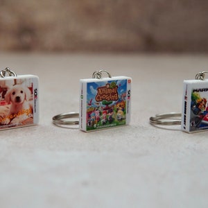 Llaveros e imanes de juegos 3DS en miniatura