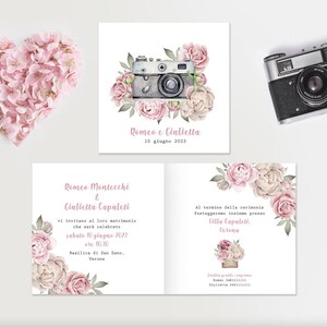 May include: A collection of wedding stationery featuring a watercolor illustration of a vintage camera surrounded by pink and cream-colored flowers. The invitation includes text in Italian, with a heart-shaped floral arrangement.