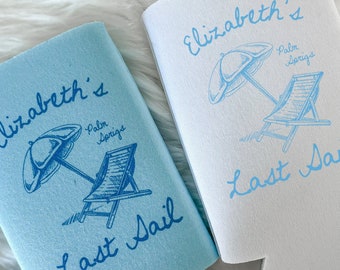 May include: Two blue and white can coolers with a beach theme. One cooler says "Elizabeth's Last Sail" with a palm tree and beach chair design. The other cooler says "Elizabeth's Last Sail" with a palm tree and beach chair design.