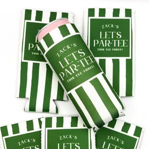 May include: A collection of green and white striped foam can coolers featuring the text ZACK'S LET'S PAR-TEE THIR-TEE THREE! printed in white. The coolers are arranged with one positioned diagonally across the others, showing a pink rim.