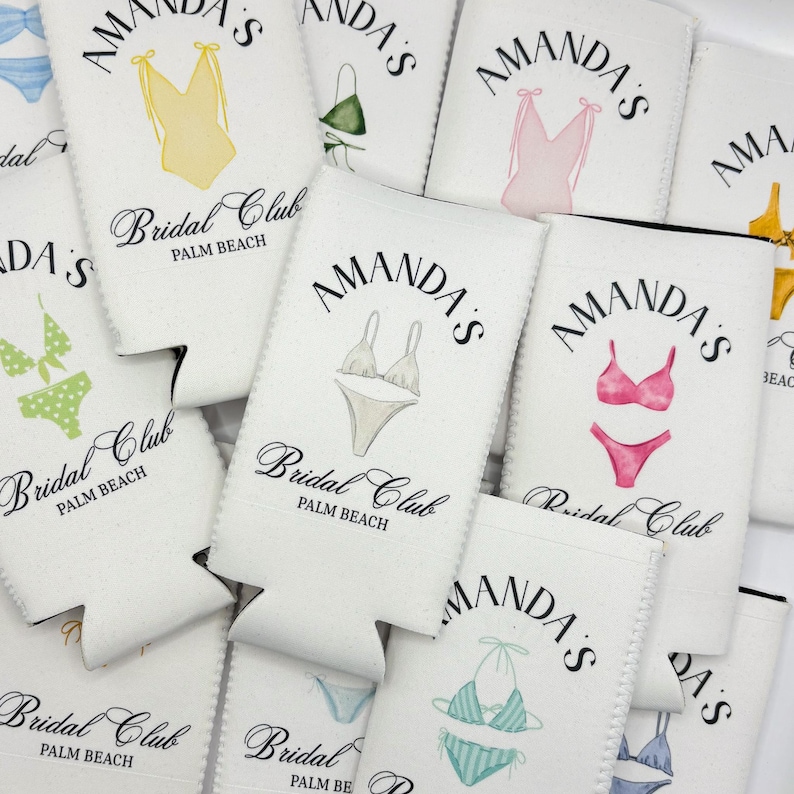 May include: White can coolers with black text and illustrations of swimsuits. The text reads "Amanda's Bridal Club Palm Beach".