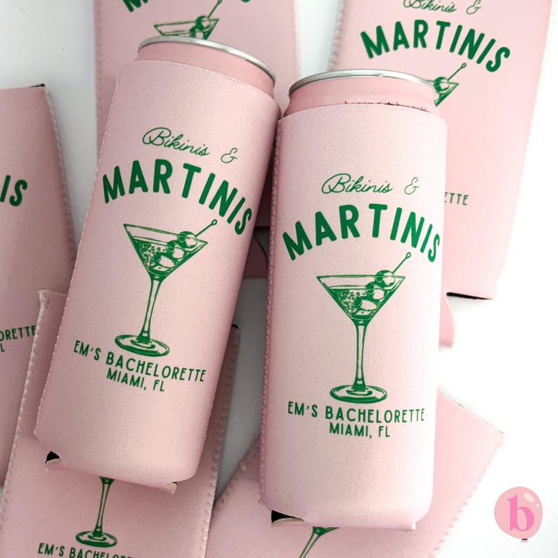 May include: Pink can coolers with the text "Bikinis & Martinis" and a green martini glass graphic. The text "EM's Bachelorette Miami, FL" is printed below the graphic.