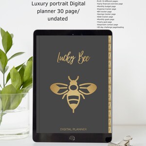 Könnte beinhalten: Ein digitaler Planer mit schwarzem Cover und einer goldenen Bienen-Illustration. Der Planer trägt den Titel "Lucky Bee Digital Planner". Das Cover enthält auch eine Monatskalenderansicht mit Registerkarten für jeden Monat.