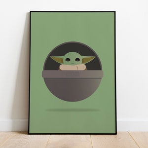 Peut inclure: Une illustration d'un personnage de la franchise Star Wars, connu sous le nom de "L'Enfant" ou "Baby Yoda", dans un pod flottant sur un fond vert.