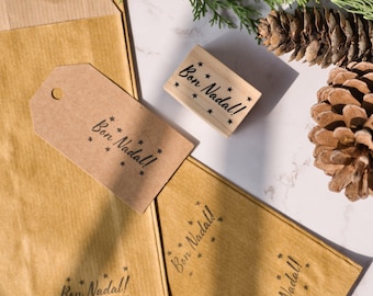 Merry Christmas stamp in different languages with stars, rubber stamp Feliz Navidad in Spanish, DIY Holiday gift tags