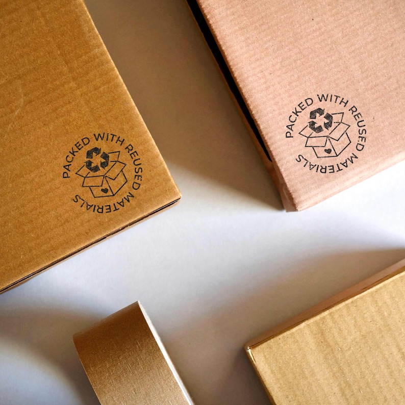 Rubber stamp for print on boxes wrapped with reused materials. Packed with reused materials stamp. Made in Barcelona by biterswit.