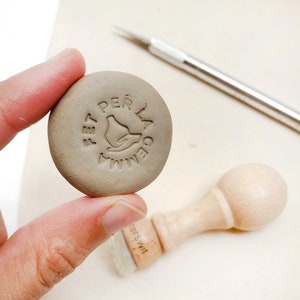 Custom pottery name stamp with minimalistic hand and vase design, Personalized ceramic mark for artists, Clay signature stamp marking tool