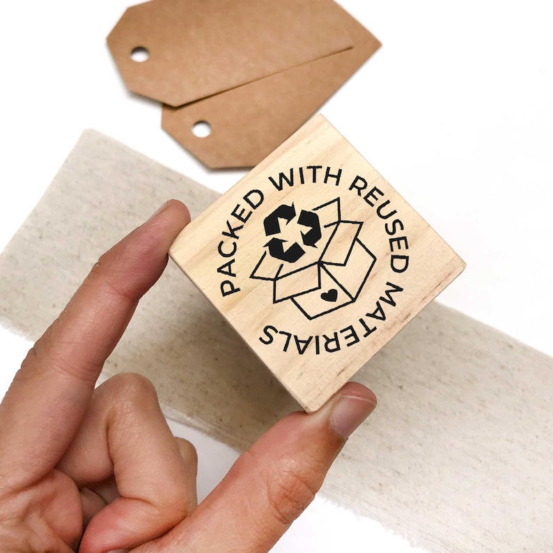 Packed with reused materials wooden stamp for eco packaging. Made in Barcelona by biterswit.