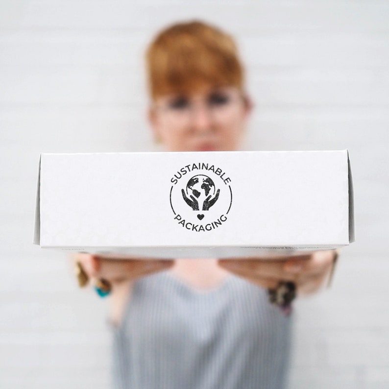 Eco-friendly packaging stamp with a Sustainable Packaging message in multiple languages, perfect for small businesses and zero-waste shipping.