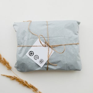 A set of mini rubber stamps featuring the recycle icon, a small yet powerful reminder to reduce waste and make sustainable choices. These tiny stamps are perfect for eco-conscious businesses that want to mark packaging, paper bags, wrapping, and product labels with a recognizable sustainability symbol. Their compact size makes them great for adding a subtle yet impactful detail to handmade products, compostable mailers, and other recyclable materials.