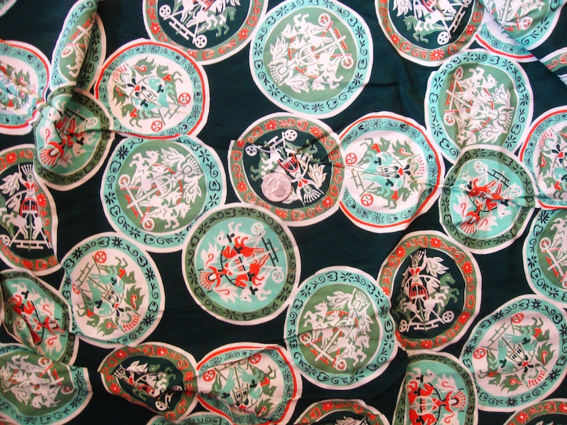 May include: A green fabric with a repeating pattern of white and red circular designs. Each circle features a stylized image of a horse-drawn carriage with a driver and passengers.
