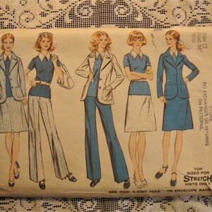 May include: A vintage sewing pattern for four different outfits. The pattern is for a size 12 bust and is designed for stretch knits. The pattern includes a blue blazer with a white and blue patterned skirt, a blue top with white and blue patterned pants, a blue top with a white skirt, and a blue top with a blue skirt.