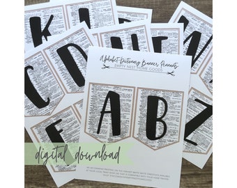 May include: A set of printable alphabet banner pennants featuring black letters on a beige dictionary page background. The pennants are labeled "A", "B", "C", "Z", "K", "D", and "F". The text "Alphabet-Dictionary Banner Pennants" and "Empty Nest Home Goods" is printed on the page. The text "digital download" is printed in a green box at the bottom of the page.