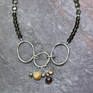 Circe - Hand Forged Silver, Smokey Quartz, Pyrite, and Pearls on Leather Adjustable Necklace