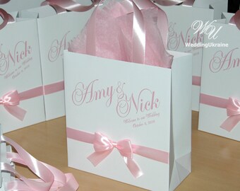 Personalisierte Hochzeitsbevorzugungsbeutel mit rosa Band und Bogen