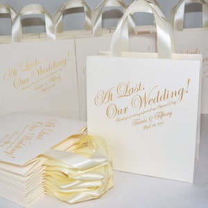 30 At last, our wedding Welcome Bags with satin ribbon handles and custom initials, Ivory & Gold Personalized wedding favor for guests