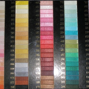 May include: A colour chart with rows of different coloured threads, numbered from 110 to 792. The chart is divided into 10 columns, each with a different colour range.