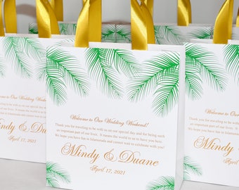 30 Tropical Wedding Welcome Bags with gold satin ribbon handles, palm leaves and names. Elegant Personalized Beach wedding favors for guests