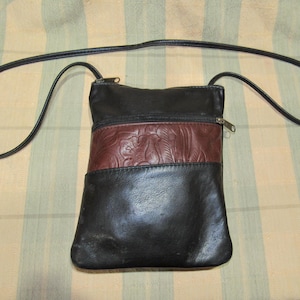 Small Black Leather Cross Body bag with Brown tooled leather accent. 9&#39;L x 7&quot;W x 1 1/2&quot;D Handmade in America with Free Shipping.  Pre-Owned.