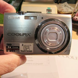 Coolpix S230 Camera, 3&quot; Touch Screen, 10 Megapixel, 3x Zoom, Charger, battery and Owners Manual.  Software Suite CD,  Preowned by me.