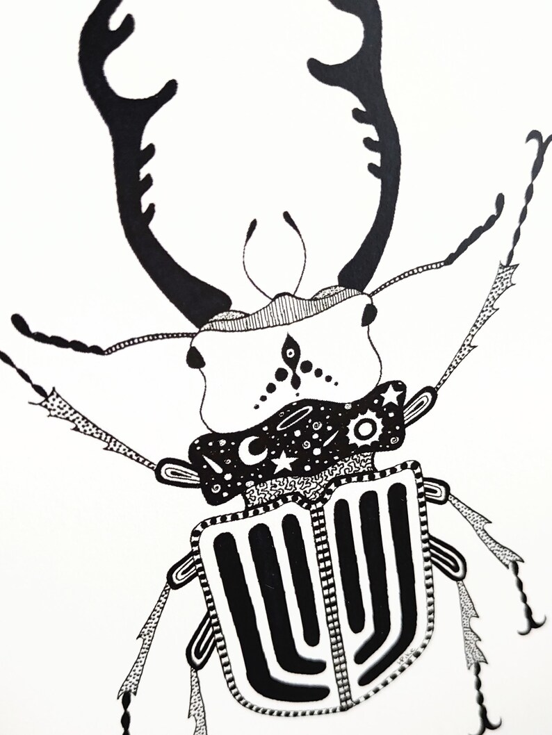 May include: Black and white line art illustration of a beetle with intricate details. The beetle has large antlers and a patterned body with a celestial design on its head.