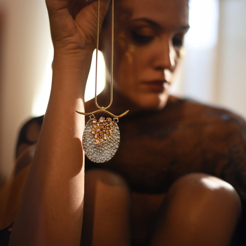 Avant-garde raw sapphire statement necklace with a bold, sculptural design, perfect for high-end couture and artistic fashion.