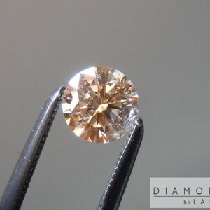 0.40ct Yellow Orange I1 Round Brilliant Diamond R7254