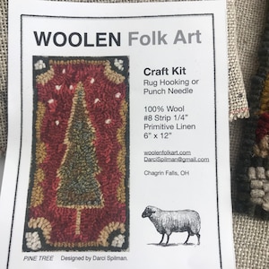May include: A craft kit for rug hooking or punch needle featuring a pine tree design. The kit includes 100% wool, #8 strip 1/4" primitive linen, and measures 6" x 12". The text "WOOLEN Folk Art" and "PINE TREE" are visible.