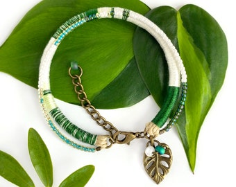 Monstera Albo tropical plant leaf bracelet with iridescent bead accents . Monstera borsigiana albovariegata . choose your length + 1" chain