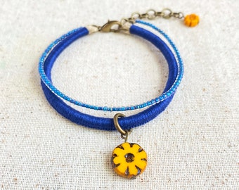 Navy blue bracelet with Czech glass flower beads and iridescent indigo bead strand . 2 strand bracelet . choose your length + 1" chain