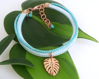 Aqua blue bracelet with rose gold Monstera leaf charm . Turquoise tropical leaf bracelet . choose your length + 1" chain