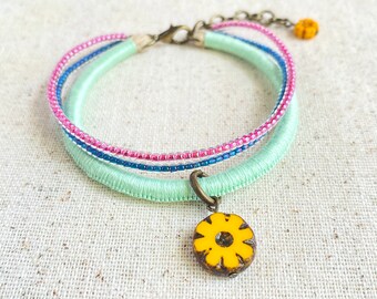 Mint green bracelet with Czech glass flower beads and indigo and fuchsia bead strands . 3 strand bracelet . choose your length + 1" chain