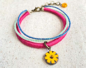 Magenta bracelet with Czech glass flower beads and mint and indigo bead strands . 3 strand bracelet . choose your length + 1" chain