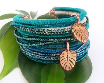Green Monstera leaf bracelet . Teal green multi-strand beaded bracelet with rose gold tropical leaf charms . choose your length