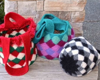 May include: Three knitted bags with different geometric patterns. The bags are red and white, teal and purple, and black and white.